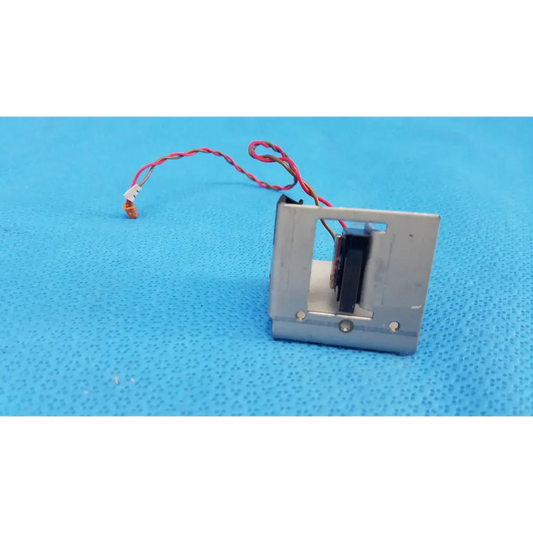 Silver metallic microswitch limit sensor with visible internals and red-white wire for retinal camera bracket assembly