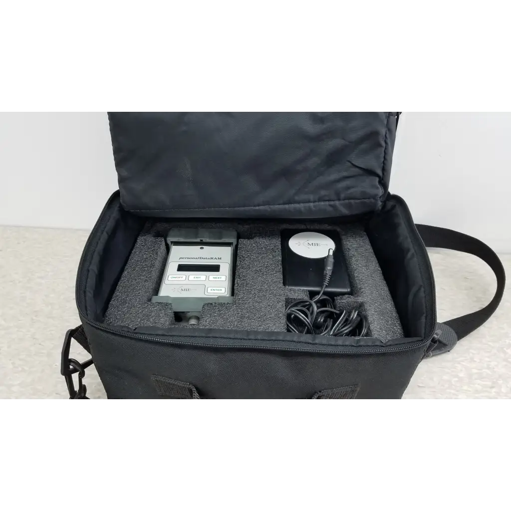Black carrying case with gray handheld mie personal data ram pdr-1000 aerosol monitor and accessories for industrial hygiene