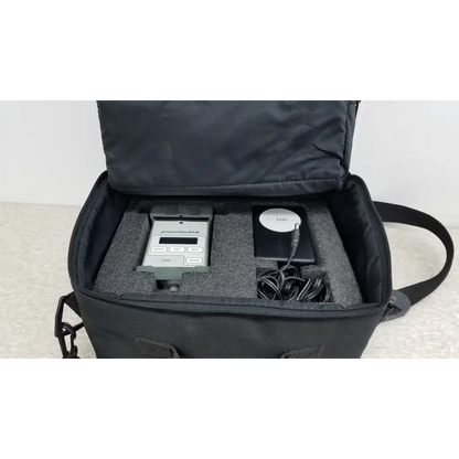 Black carrying case with gray handheld mie personal data ram pdr-1000 aerosol monitor and accessories for industrial hygiene