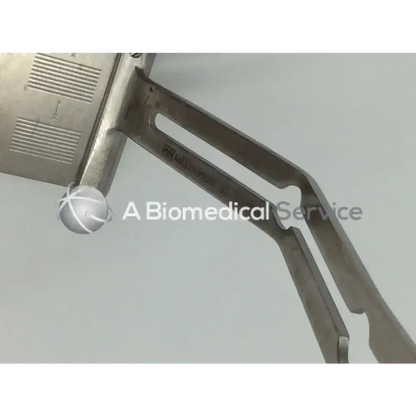 Silver millennium surgical instrument with textured grip and engraved markings featuring wexler expendable blade design