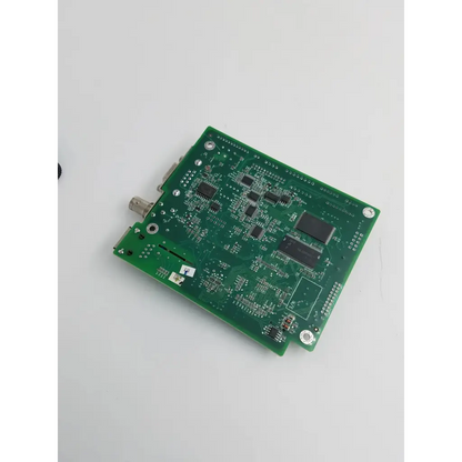 Green rectangular patient monitor main circuit board with black integrated circuits and silver connectors for mindray device