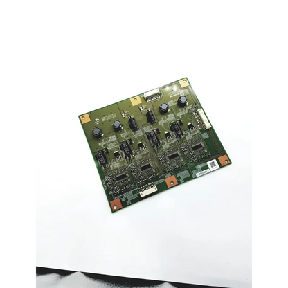 Green rectangular minebea dm63009 u84pa-e0015436a inverter board with black components and gold-colored mounting points
