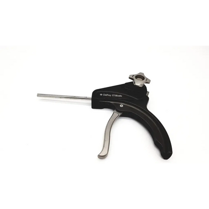 Black and silver depuy mitek versalok deployment gun with textured grip handle for secure surgical deployment use