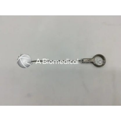 Silver mitek surgical rapidlok pusher with spherical cross-hatched head and ringed handle for orthopedic use