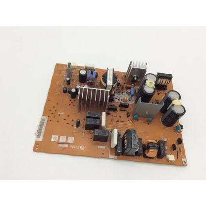 Orange circuit board of mitsubishi 934c2280 power supply unit with black capacitors resistors and silver heatsink