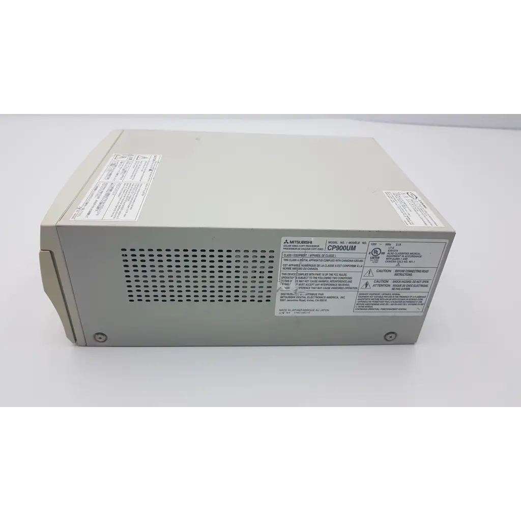 Beige mitsubishi cp900um analog color video printer power supply with perforated ventilation panel and regulatory labels visible