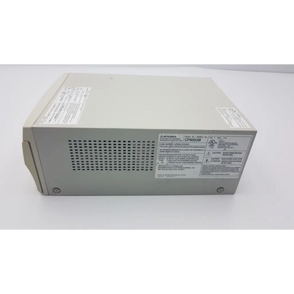 Beige mitsubishi cp900um analog color video printer power supply with perforated ventilation panel and regulatory labels visible