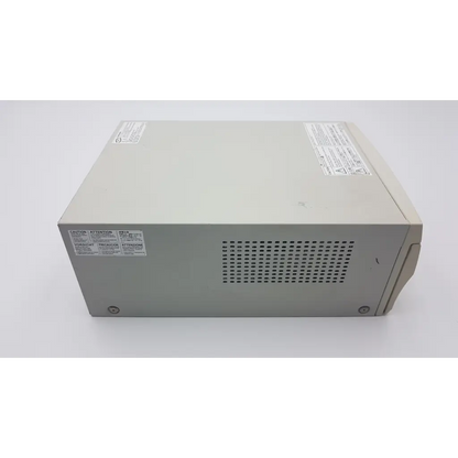 Beige plastic power supply unit with ventilation grille and warning labels on the back of mitsubishi cp900um analog printer