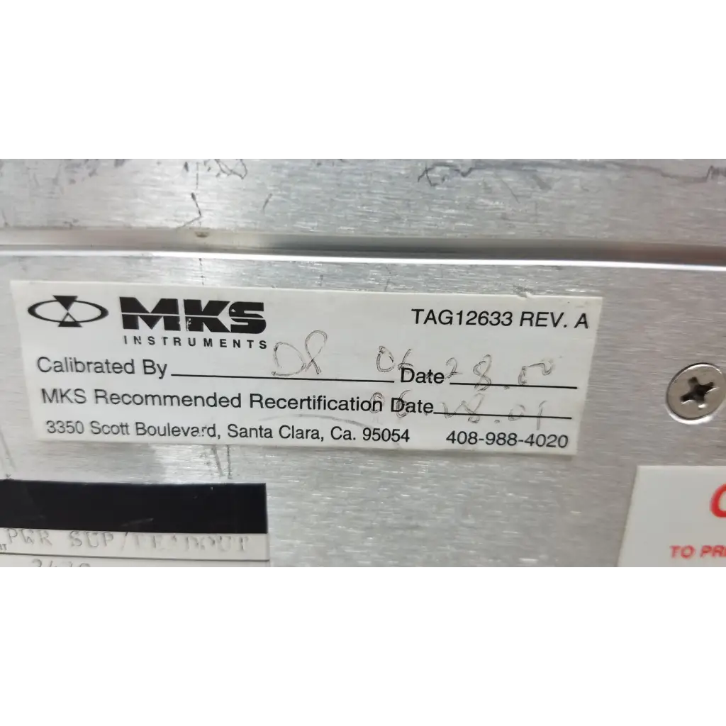White label with black mks instruments logo on metallic surface of mass flow controller power supply unit