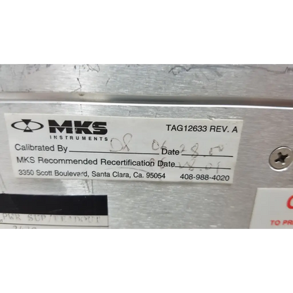 White label with black mks instruments logo on metallic surface of mass flow controller power supply unit