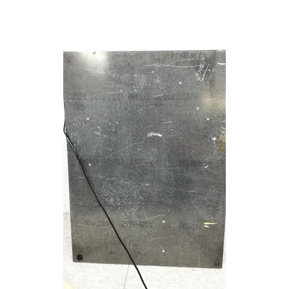 Scratched dark gray metal panel on the back side of mmr technologies vacuum control manifold system with granville-phillips gauge