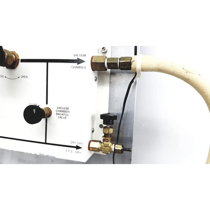 Brass valve with black handle labeled vacuum chamber backfill valve on white panel in mmr technologies vacuum control manifold