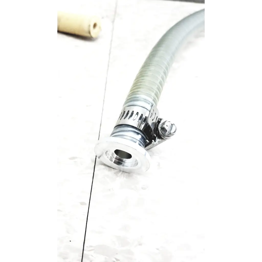 A flexible translucent gray hose with a chrome clamp used in mmr technologies vacuum control manifold system