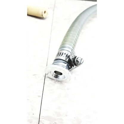 A flexible translucent gray hose with a chrome clamp used in mmr technologies vacuum control manifold system