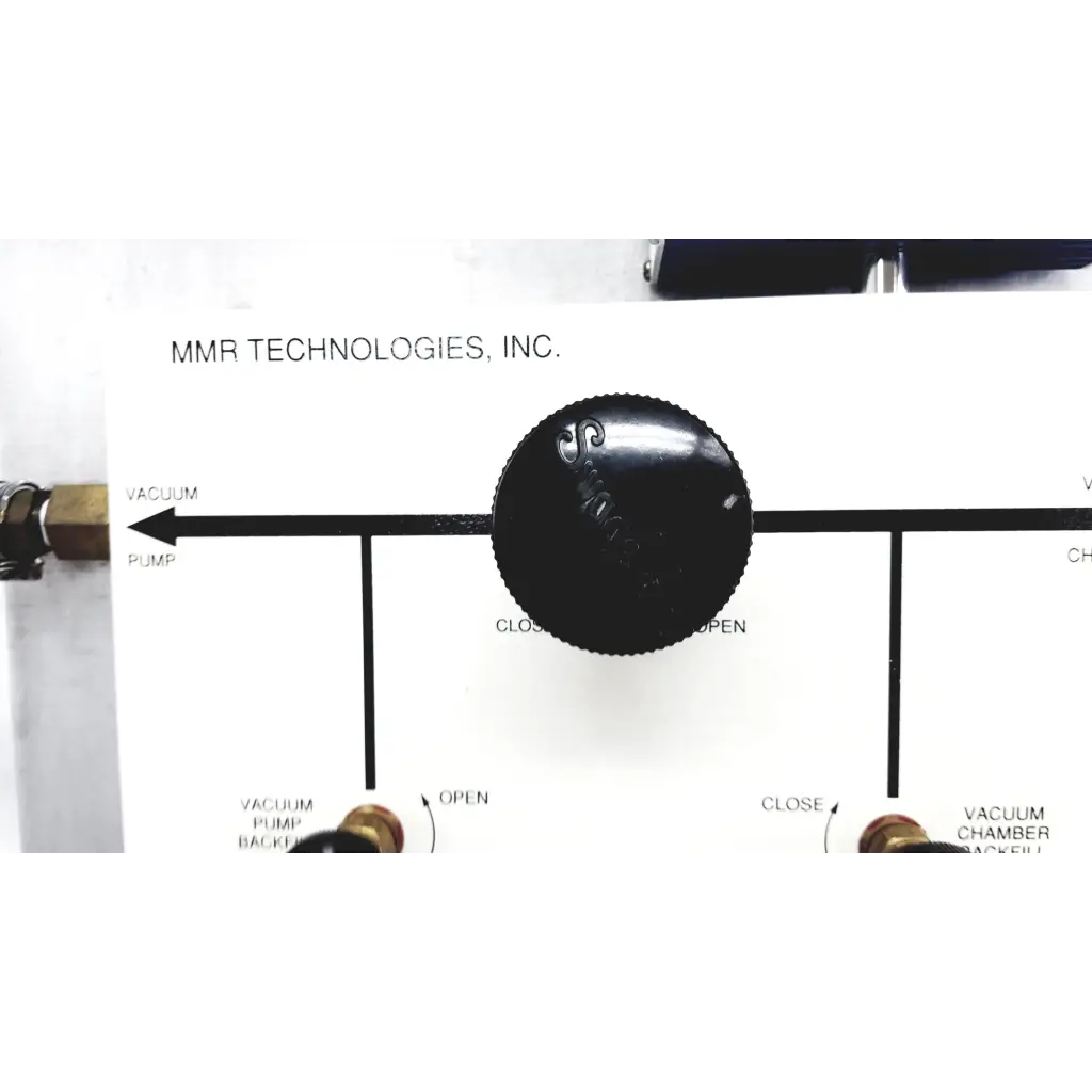 Black circular knob with textured grip and embossed logo on mmr technologies vacuum control manifold system panel