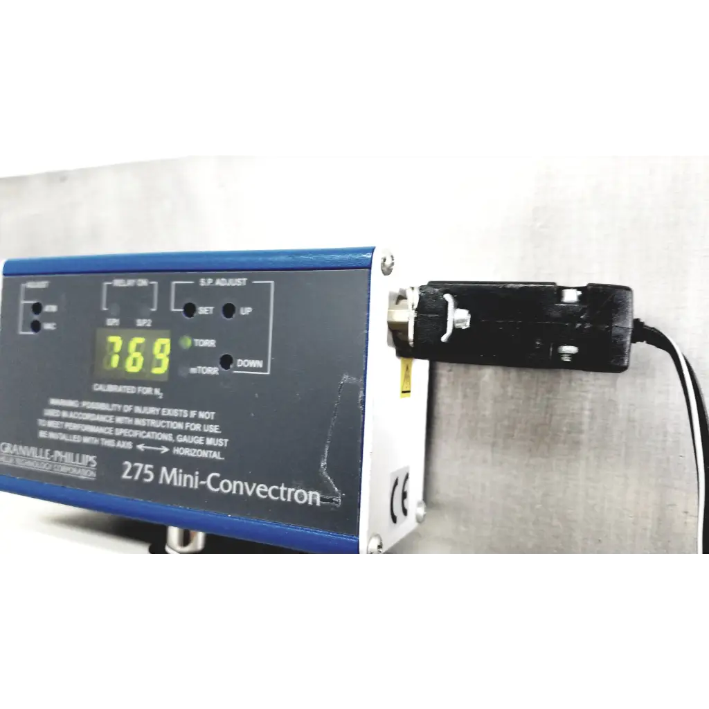 Blue and white granville-phillips 275 mini-convection oven control panel digital display showing 769 for vacuum control manifold