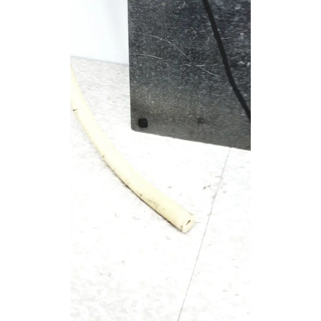 Beige flexible plastic hose part of mmr technologies vacuum control manifold system with granville-phillips gauge on floor