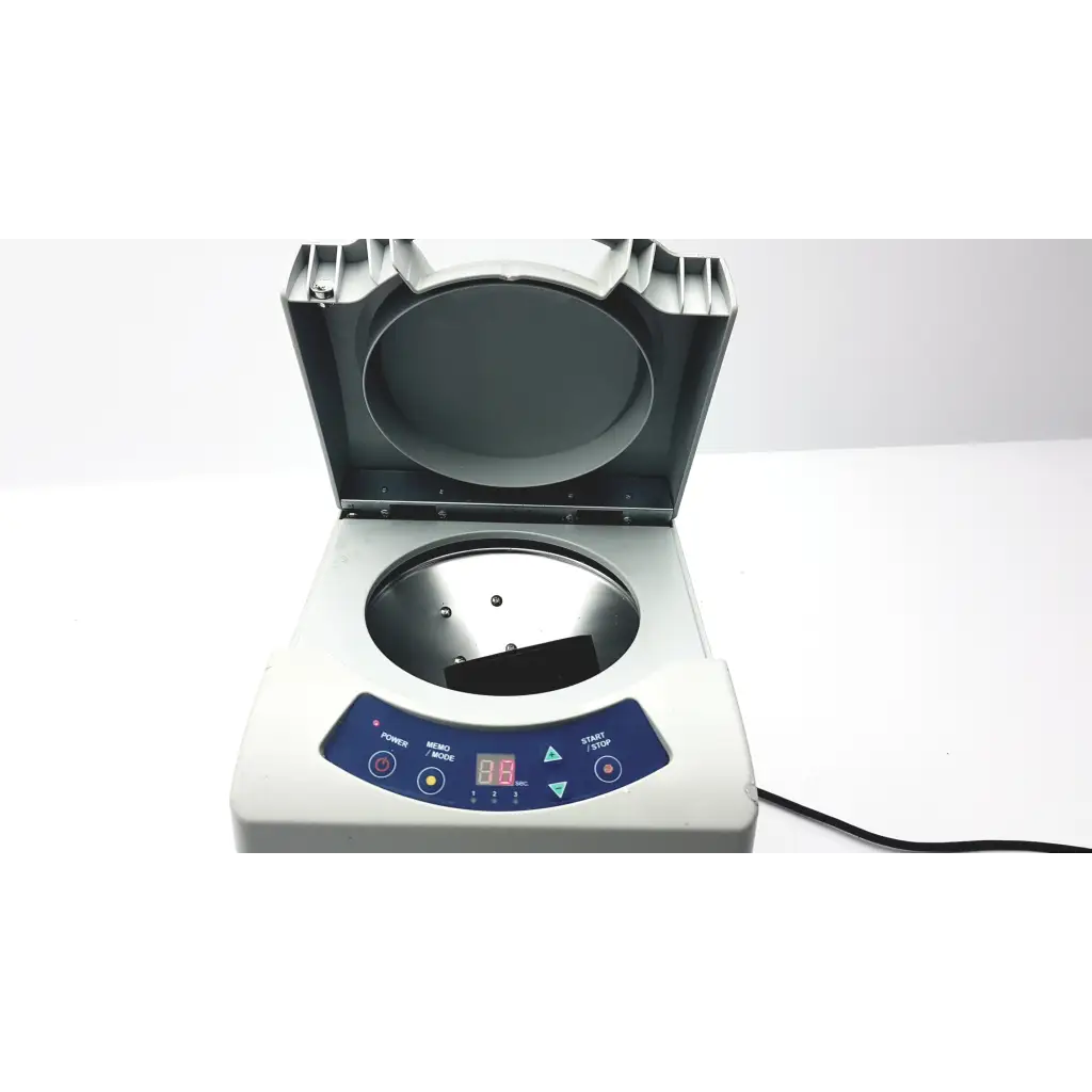 White countertop monitex industrial turbomax v3 aligate mixer gx300 with blue panel and open empty rotor chamber