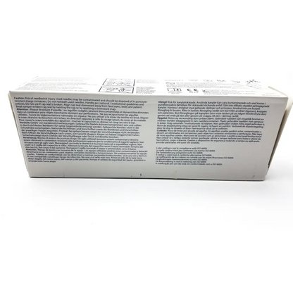 White rectangular package of monoject standard hypodermic needle 22g011 with black text and faint logo in bottom right corner