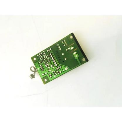 Green rectangular mpv2a003 control board with silver soldered components and small gray connector wire