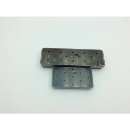 Two rectangular metal dental impression trays with perforated surfaces for use in the multipak 5006-50-000p sterilization container