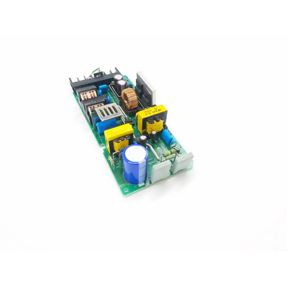 Nagano Japan AHS100-24 power supply board with green PCB, blue yellow capacitors, copper windings, and black heat sinks