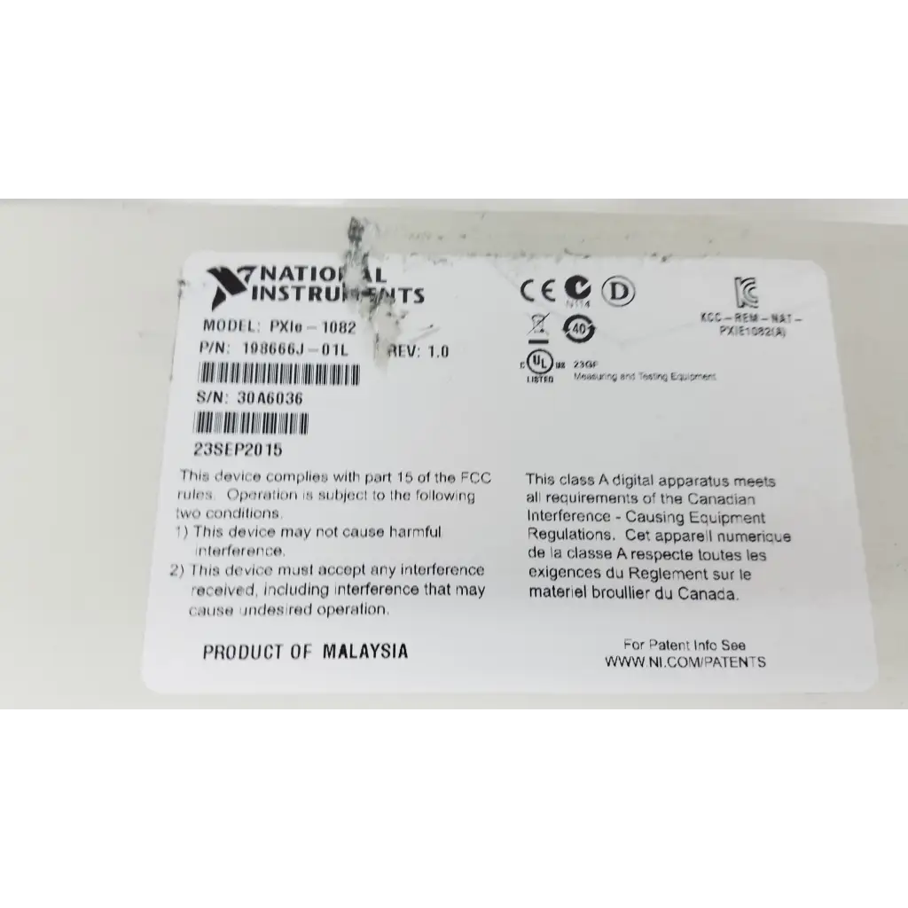 White rectangular label on national instruments pxi express ni pxie-1082 data acquisition chassis with modules