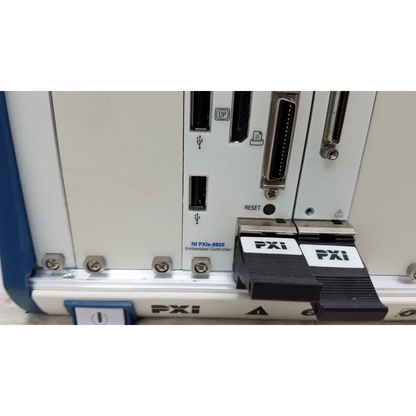 Black national instruments pxi express interface connectors with white labels on white ni pxie-8820 embedded controller chassis