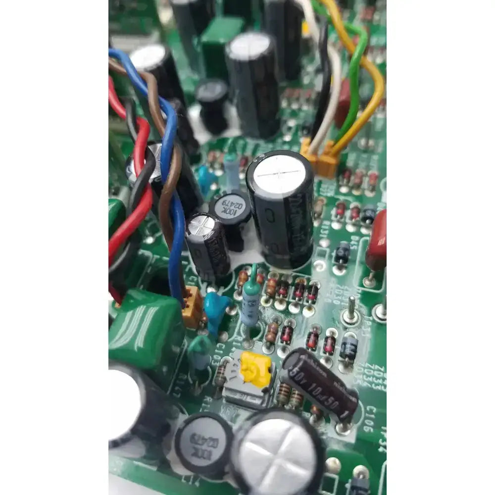 Nayuta NB497 SPU-10 green power supply control board with black capacitors resistors and multicolored wires