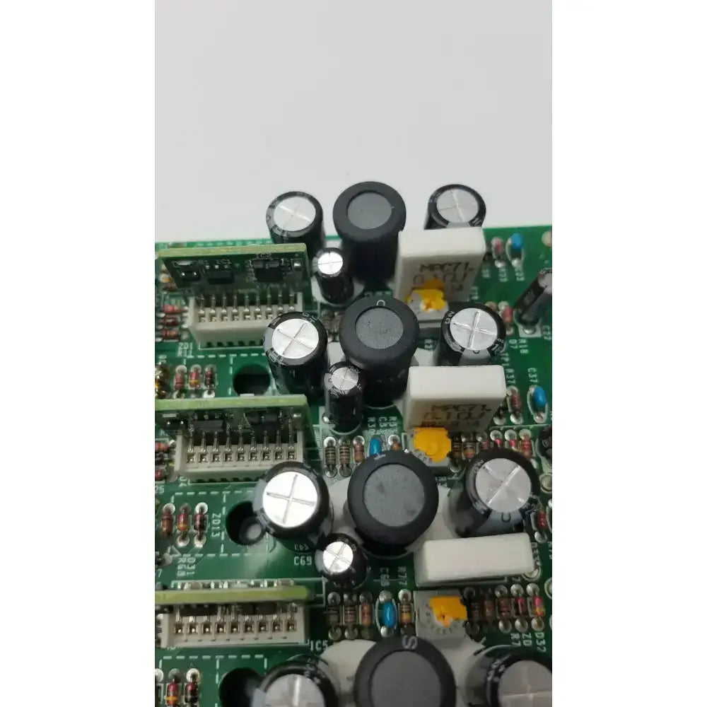 Green printed circuit board with black and silver capacitors and white connectors in nayuta nb497 power supply control board