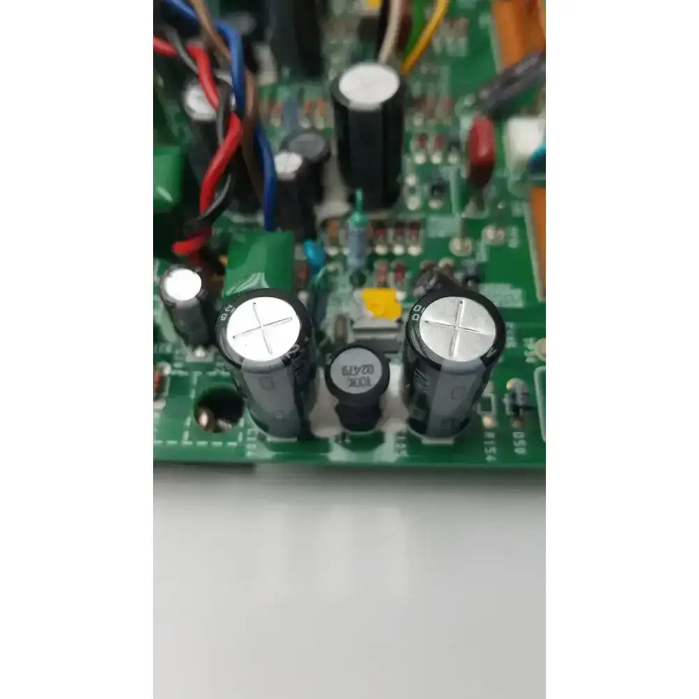 Black cylindrical capacitors with silver tops on the green nayuta nb497 spu-10 94v-0 power supply control board