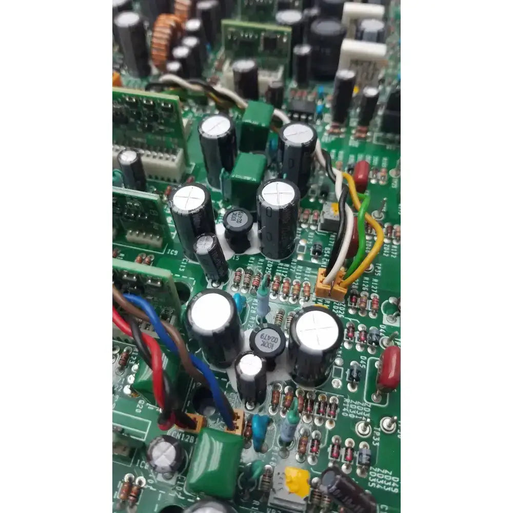 Nayuta NB497 SPU-10 94V-0 green power supply control board with black cylindrical capacitors and electronic components