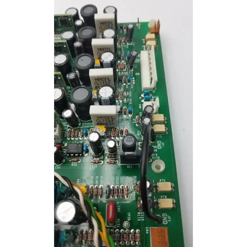 Green printed circuit board with black and white capacitors and resistors on nayuta nb497 spu-10 power supply control board