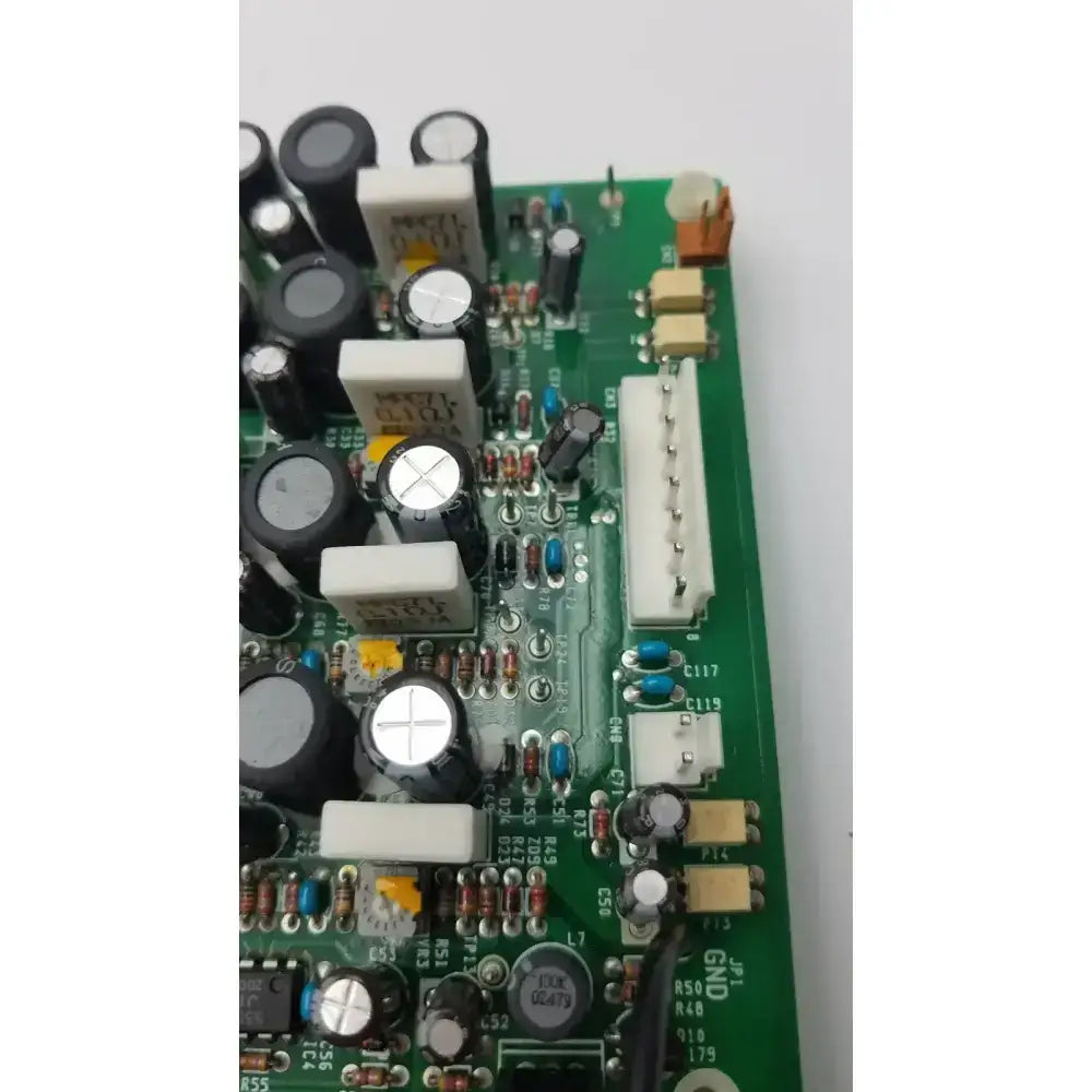 Nayuta NB497 SPU-10 94V-0 green power supply control board with black and white capacitors and resistors mounted