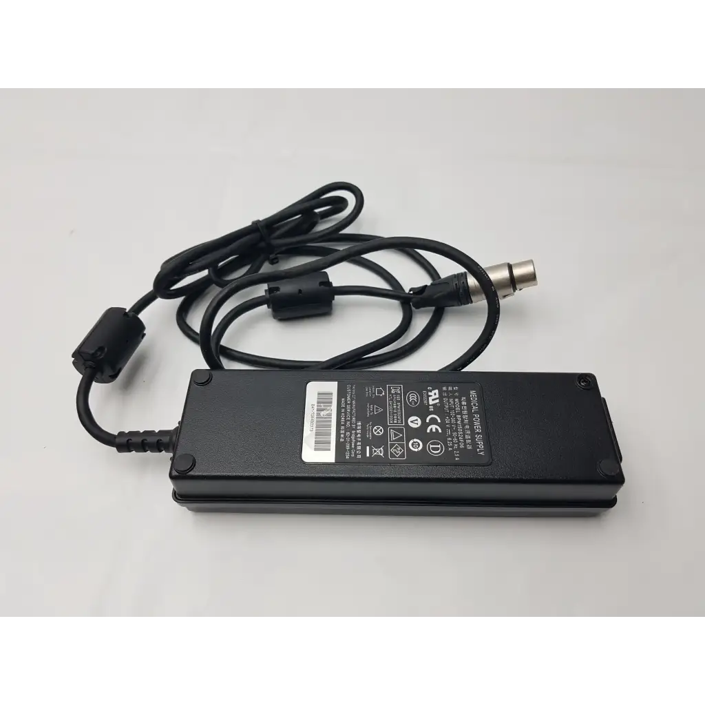 Black rectangular NDS BPM150S24F06 medical power supply AC adapter with coiled cable and metallic connector