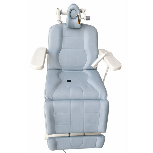 Light blue padded biomed certified neuronetics neurostar TMS therapy patient chair with adjustable headrest and armrests