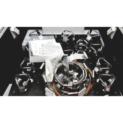 Silver metallic spring-loaded industrial clamps on a black workbench for brunswick scientific innova incubator 4080