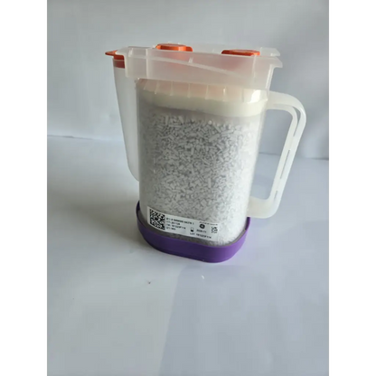 Transparent plastic measuring jug with orange caps and white handle filled with healthcare zplege-01 absorbent granules