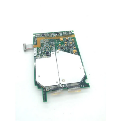 Green nibp assembly board with two white heat sinks and silver ribbon cable connector model 0320-0324 670-0842-01