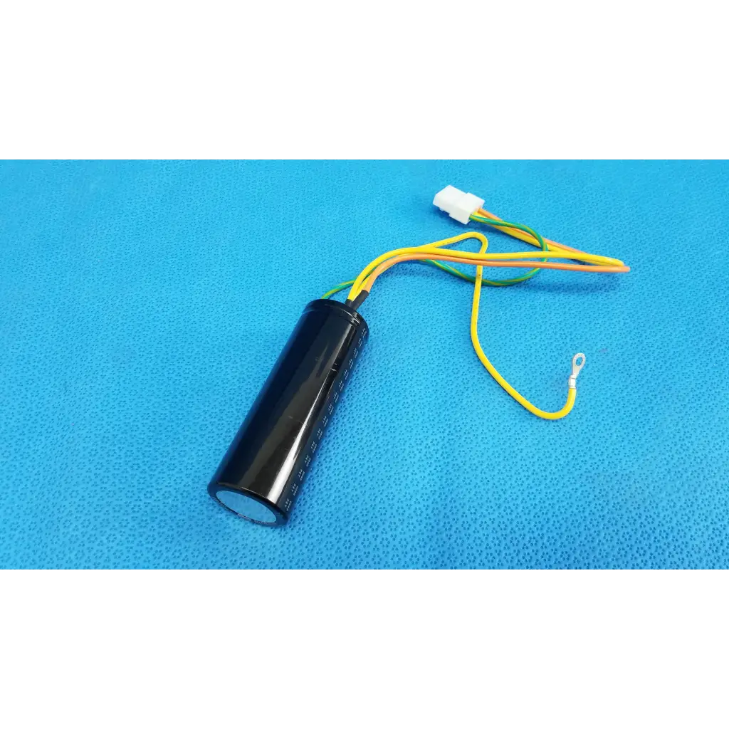 Black cylindrical nichicon power supply capacitor with yellow and green wires and white connector for fundus retinal camera