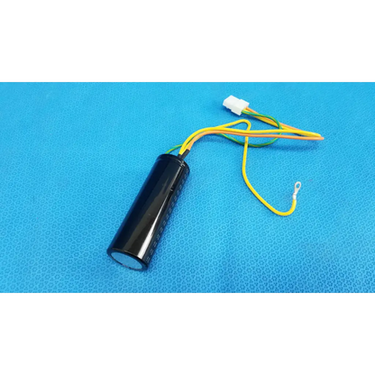 Black cylindrical nichicon power supply capacitor with yellow and green wires and white connector for fundus retinal camera