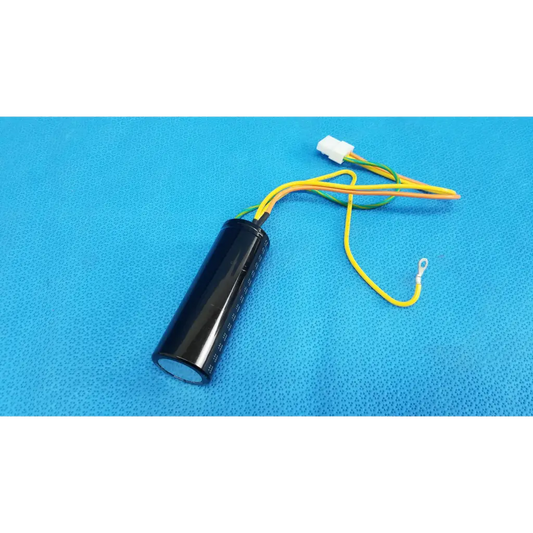 Black cylindrical nichicon power supply capacitor with yellow and green wires and white connector for fundus retinal camera