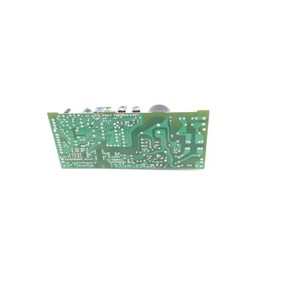 Green rectangular nichicon n- f00-5u11-12 circuit board with silver solder points and electronic components on top edge n-t00-706