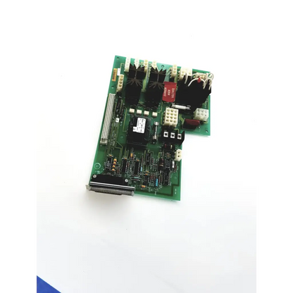 Green printed circuit board with black white components red capacitors and silver connector edge nichicon sno-6a board