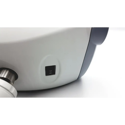 White and gray plastic nidek cp-770 chart projector with black power button and wall mount attachment