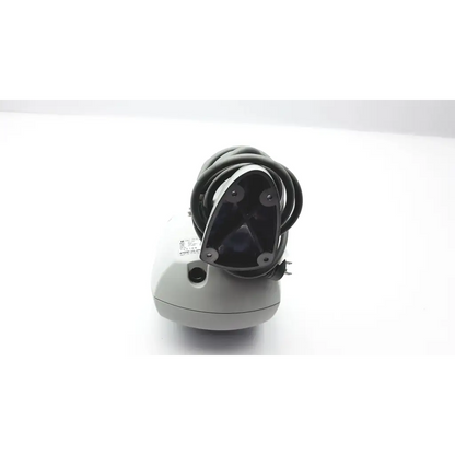 Gray plastic nidek cp-770 chart projector showing back with black coiled cable and triangular wall mount bracket
