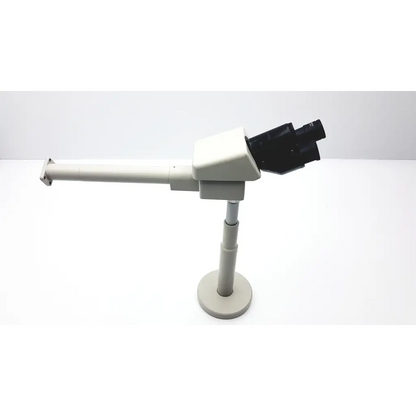 Nikon 030039 binocular microscope is a sleek off-white binocular microscope with black eyepieces on an adjustable stand