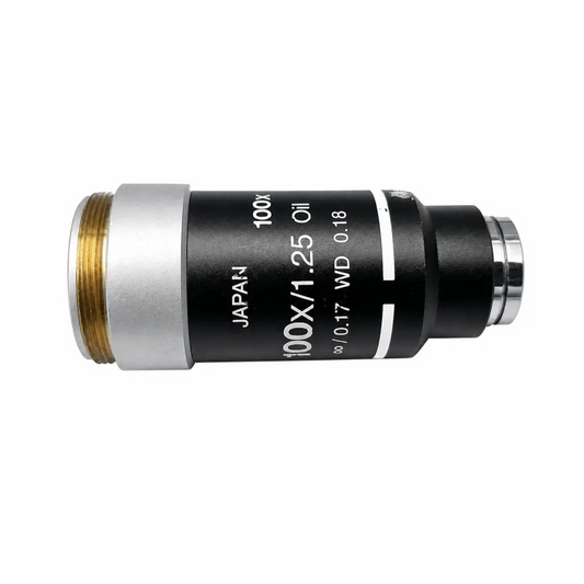 Black and silver Nikon 100x oil microscope objective with gold threading labeled Japan for medical equipment use
