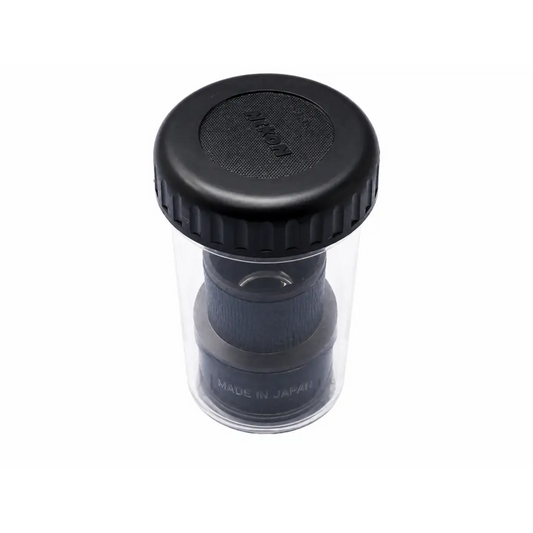 Black nikon lens cap with textured grip and clear plastic container for nikon cfi 15x microscope eyepiece case