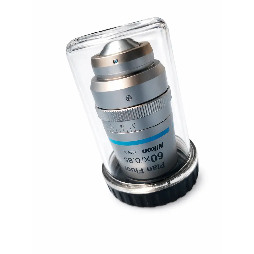 Silver nikon mrh00602 cfi plan fluor 60x 0.85 microscope objective with blue stripe in clear protective casing for medical equipment